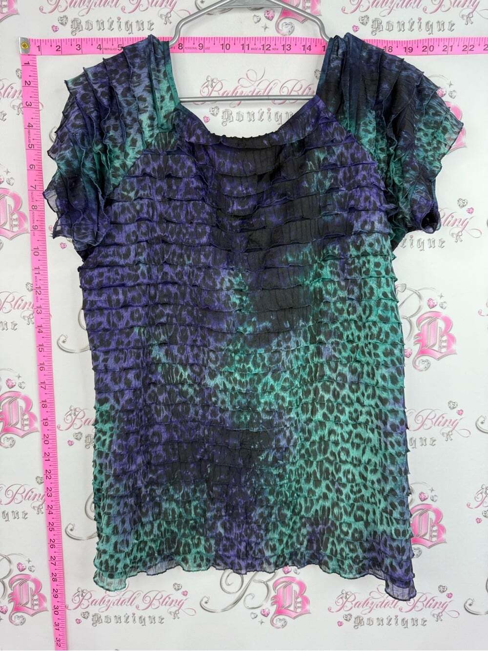 Bellissima Women’s Animal-Print Ruffled Short Sleeve Blouse in Teal & Purple